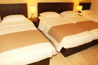Postel nebo postele na pokoji v ubytování Rea Hotel
