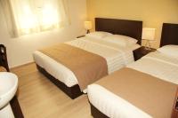 Postel nebo postele na pokoji v ubytování Rea Hotel