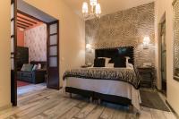 Posteľ alebo postele v izbe v ubytovaní El Rey Moro Hotel Boutique