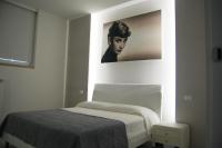 A bed or beds in a room at Maison Audrey