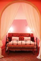 a bedroom with a bed with a canopy at Raid Garden Boutique Hotel in Magong