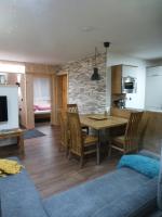 a kitchen and dining room with a table and chairs at Chalet Auszeit in Arzl im Pitztal