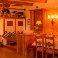 a dining room with a table and a bowl on a counter at Hotel Waldhaus Föckinghausen in Bestwig