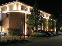 a building with cars parked in front of it at PARKHOTEL - Rosarium in Uetersen