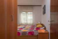 A bed or beds in a room at Apartments Cuk