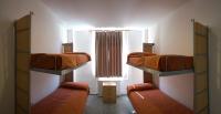 A bed or beds in a room at Albergue Inturjoven Granada