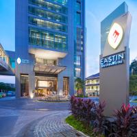 an office building with a sign in front of it at Eastin Grand Hotel Sathorn in Bangkok