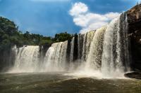 a waterfall in the middle of a river at New Center Hotel in Carolina