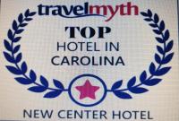 a sign for a top hotel in carolina at New Center Hotel in Carolina