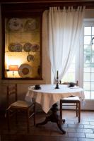 a dining room with a table and a window at La Bribaudonnière in Saint-Palais-de-Phiolin