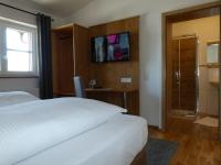 Postel nebo postele na pokoji v ubytování Hotel Fischachstubn