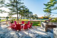 a patio with red chairs and a table at Rawley Resort, Spa & Marina in Port Severn