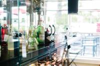 a glass counter with bottles of alcohol on it at Rawley Resort, Spa & Marina in Port Severn