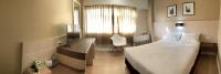 Ein Bett oder Betten in einem Zimmer der Unterkunft Srivichai Hotel