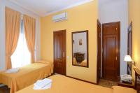 A bed or beds in a room at Hostal Edreira