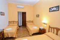 A bed or beds in a room at Hostal Edreira