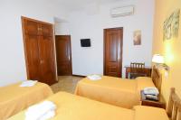 A bed or beds in a room at Hostal Edreira