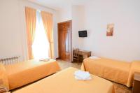 A bed or beds in a room at Hostal Edreira