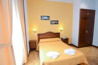 A bed or beds in a room at Hostal Edreira