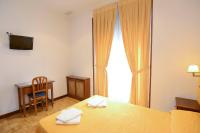 A bed or beds in a room at Hostal Edreira