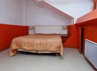 Een bed of bedden in een kamer bij H&ocirc;tel du Pont Neuf