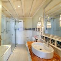 a bathroom with a sink and a shower and a tub at Sacristia de Santa Ana in Seville