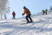 a group of people skiing down a snow covered slope at Gasthof Holländer Eck in Lennestadt