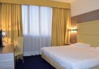 Posteľ alebo postele v izbe v ubytovaní Palace Inn Rome Fiano
