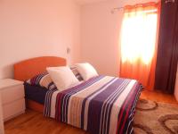Posteľ alebo postele v izbe v ubytovaní Apartman Karlo