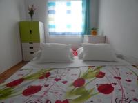 Posteľ alebo postele v izbe v ubytovaní Apartman Karlo