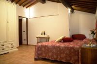 A bed or beds in a room at SassoMatto b&b BioAgrituRelax