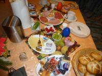 a table topped with plates of food on top at Pension am Peeneufer UG in Wolgast