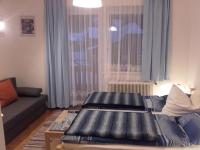 A bed or beds in a room at Gasthof Steiner