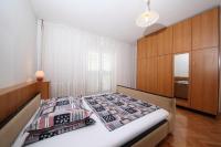 Posteľ alebo postele v izbe v ubytovaní Family Apartments Marita