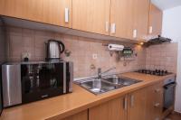 Kuchyňa alebo kuchynka v ubytovaní Family Apartments Marita