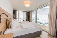 Łóżko lub łóżka w pokoju w obiekcie Adler Resort