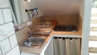 Kuchyň nebo kuchyňský kout v ubytování Holiday Homes Mare