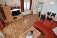 TV a/nebo společenská místnost v ubytování Villa Strandidyll Wohnung 9