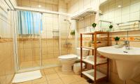 a bathroom with a toilet and a sink and a shower at Nature House Homestay in Dongshan