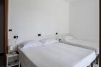 A bed or beds in a room at Bed & Breakfast Cesarina
