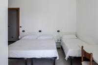 A bed or beds in a room at Bed & Breakfast Cesarina