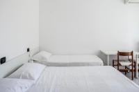 A bed or beds in a room at Bed & Breakfast Cesarina