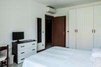 A bed or beds in a room at Bed & Breakfast Cesarina