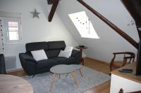 a living room with a couch and a table at appartement à Colmar in Colmar