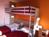two bunk beds in a room with two beds at Premiere Classe Perpignan Sud in Perpignan