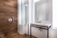 a bathroom with a sink and a shower at Hotel Marais Grands Boulevards in Paris