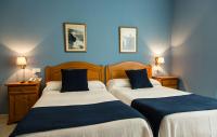 Posteľ alebo postele v izbe v ubytovaní Hotel Villa del Son