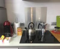 A kitchen or kitchenette at Camp Nou, Europa Fira - modern two-bedroom apartment with heating