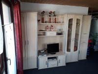 Televízia a/alebo spoločenská miestnosť v ubytovaní Family-Appartements