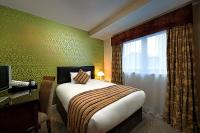 Postel nebo postele na pokoji v ubytování George Limerick Hotel